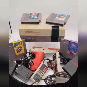 Vintage Nintendo game console with accessories